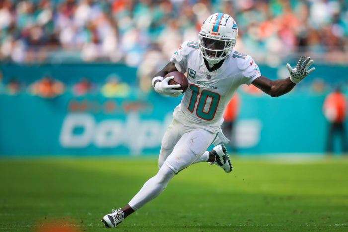 Oct 15, 2023; Miami Gardens, Florida, USA; Miami Dolphins wide receiver Tyreek Hill (10) runs with the football against the Carolina Panthers during the second quarter at Hard Rock Stadium. Mandatory Credit: Sam Navarro-USA TODAY Sports